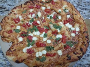 This is the decimated pizza AFTER my second attempt. Unfortunately, I didn't think to take a picture of the actual crime scene because I was too busy yelling obscenities.